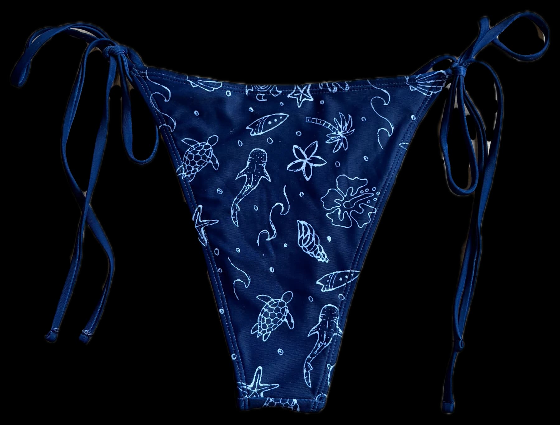 The Oceania bikini bottom in navy with a hand-drawn ocean print